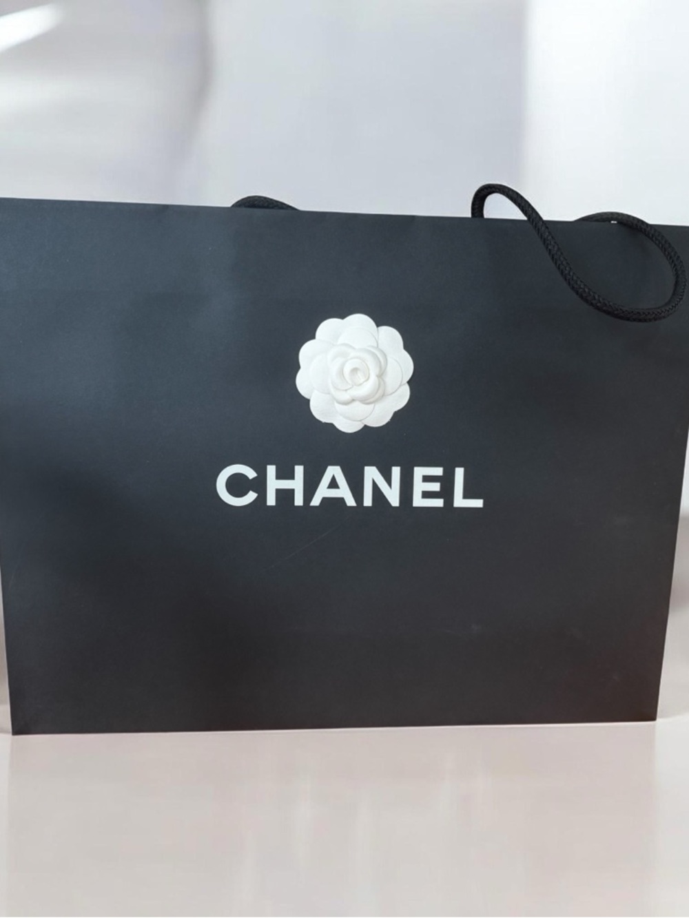 CHANEL Black Shopping Tote with White Camellia